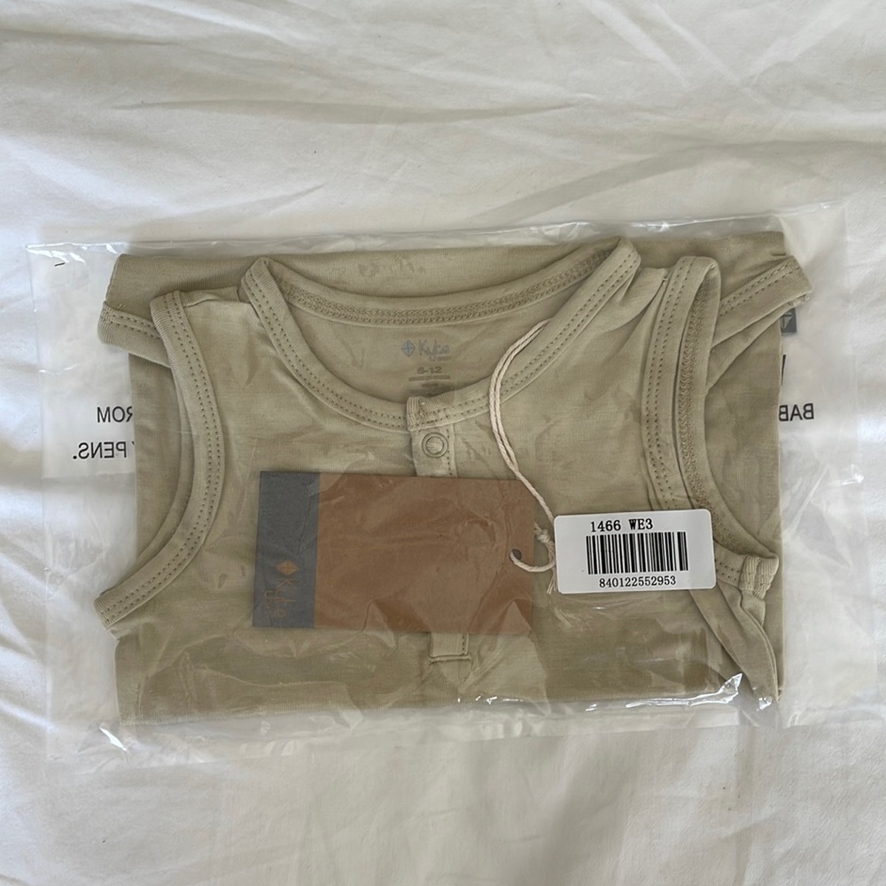 Kyte baby sleeveless body suit in wheat